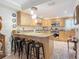 Kitchen with breakfast bar and modern light fixture at 2100 N Peninsula Ave # 1150, New Smyrna Beach, FL 32169