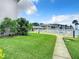 Well-maintained grassy backyard with a pathway at 2100 N Peninsula Ave # 1150, New Smyrna Beach, FL 32169