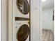 Convenient laundry closet with stackable washer and dryer at 2100 N Peninsula Ave # 1150, New Smyrna Beach, FL 32169