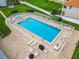 Community pool with plenty of lounge chairs at 2100 N Peninsula Ave # 1150, New Smyrna Beach, FL 32169