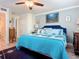 Bright bedroom with a king-size bed and ocean-themed decor at 2100 N Peninsula Ave # 1150, New Smyrna Beach, FL 32169