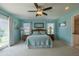 Primary bedroom with a ceiling fan and ocean views at 320 Due East St, New Smyrna Beach, FL 32169