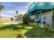 Inviting backyard oasis featuring a sparkling pool, spa, and lush landscaping at 320 Due East St, New Smyrna Beach, FL 32169