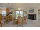 Elegant dining room with a glass table, chandelier, and ocean views at 320 Due East St, New Smyrna Beach, FL 32169