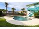 Enjoy this kidney-shaped pool and spa with a tranquil waterfall feature at 320 Due East St, New Smyrna Beach, FL 32169