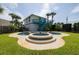 Charming backyard with a kidney-shaped pool and spa at 320 Due East St, New Smyrna Beach, FL 32169