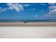 Tranquil beach scene with people enjoying the sun at 320 Due East St, New Smyrna Beach, FL 32169
