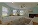 Bright bedroom with a comfortable bed, ample natural light, and a ceiling fan at 320 Due East St, New Smyrna Beach, FL 32169
