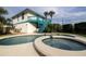 Private backyard with a refreshing pool and attached spa at 320 Due East St, New Smyrna Beach, FL 32169