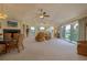 Spacious living area with a fireplace and access to a balcony at 320 Due East St, New Smyrna Beach, FL 32169