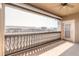 Private balcony with stone balustrade and view of surrounding area at 424 Luna Bella Ln # 433, New Smyrna Beach, FL 32168