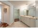 Double vanity bathroom with access to a walk-in closet at 424 Luna Bella Ln # 433, New Smyrna Beach, FL 32168
