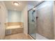 Bathroom with a large walk-in shower and soaking tub at 424 Luna Bella Ln # 433, New Smyrna Beach, FL 32168