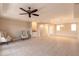 Spacious living room with tile floors and neutral walls at 424 Luna Bella Ln # 433, New Smyrna Beach, FL 32168