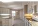 Eat-in kitchen with granite countertops and white cabinets at 424 Luna Bella Ln # 433, New Smyrna Beach, FL 32168