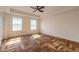 Bright bedroom with hardwood floors and ceiling fan at 424 Luna Bella Ln # 433, New Smyrna Beach, FL 32168