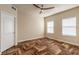 Bright bedroom with wood-look floors and ceiling fan at 424 Luna Bella Ln # 433, New Smyrna Beach, FL 32168