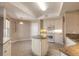 Kitchen boasts granite countertops and white cabinets at 424 Luna Bella Ln # 433, New Smyrna Beach, FL 32168