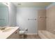 Light blue bathroom with a bathtub and single sink vanity at 424 Luna Bella Ln # 433, New Smyrna Beach, FL 32168