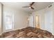 Bedroom with herringbone floors, access to patio, and en-suite bathroom at 424 Luna Bella Ln # 433, New Smyrna Beach, FL 32168