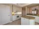 Bright kitchen with granite countertops and white cabinets at 424 Luna Bella Ln # 433, New Smyrna Beach, FL 32168
