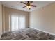 Spacious bedroom featuring herringbone floors and a ceiling fan at 424 Luna Bella Ln # 433, New Smyrna Beach, FL 32168