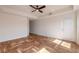Sunlit living room featuring hardwood floors and access to a balcony at 424 Luna Bella Ln # 433, New Smyrna Beach, FL 32168