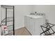 Laundry room with washer, dryer, and shelving unit at 350 Sunset Point Dr, Ormond Beach, FL 32174