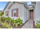 Front entry with landscaping and walkway at 350 Sunset Point Dr, Ormond Beach, FL 32174