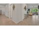 Bright hallway with tile flooring, leading to living room and other rooms at 350 Sunset Point Dr, Ormond Beach, FL 32174