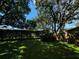 Large backyard with lush lawn and mature trees at 1780 Otisco Way, Winter Springs, FL 32708
