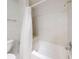 Simple bathroom with shower/tub combo and white tile at 1780 Otisco Way, Winter Springs, FL 32708