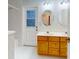 Double vanity bathroom with door leading outside at 1780 Otisco Way, Winter Springs, FL 32708