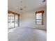 Large bedroom with carpet, window, and patio access at 1780 Otisco Way, Winter Springs, FL 32708