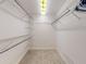 Spacious walk-in closet with wire shelving and hanging rods at 1780 Otisco Way, Winter Springs, FL 32708
