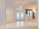 Bright entryway with double doors and tile flooring at 1780 Otisco Way, Winter Springs, FL 32708
