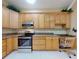 Kitchen features granite countertops and wood cabinets at 1780 Otisco Way, Winter Springs, FL 32708
