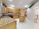 Spacious kitchen with granite countertops and island at 1780 Otisco Way, Winter Springs, FL 32708