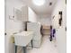 Clean laundry room, featuring a washer, dryer, and storage cabinets at 1780 Otisco Way, Winter Springs, FL 32708