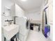 Bright laundry room with washer, dryer, and utility sink at 1780 Otisco Way, Winter Springs, FL 32708