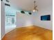 Living room with hardwood floors and access to patio at 1780 Otisco Way, Winter Springs, FL 32708