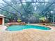 Inviting kidney-shaped pool with a covered patio area at 1780 Otisco Way, Winter Springs, FL 32708