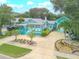 House with a circular driveway and lush landscaping at 412 S Peninsula Ave, New Smyrna Beach, FL 32169