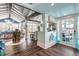 Open concept dining area with a rustic wooden table and kitchen bar at 412 S Peninsula Ave, New Smyrna Beach, FL 32169