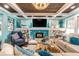 Living room features a fireplace with unique tilework and built-in shelving at 412 S Peninsula Ave, New Smyrna Beach, FL 32169