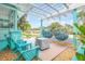 Relaxing patio area with hanging chairs and fire pit at 412 S Peninsula Ave, New Smyrna Beach, FL 32169