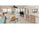 Living room with ocean view, featuring comfortable seating and access to balcony at 3855 S Atlantic Ave # 1206B, Daytona Beach, FL 32118