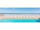Inviting pool area with oceanfront views and lounge chairs at 3855 S Atlantic Ave # 1206B, Daytona Beach, FL 32118