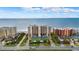 Oceanfront building, tennis court, and parking area at 4139 S Atlantic Ave # B103, New Smyrna Beach, FL 32169