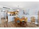 Charming dining area with wood table and chairs, kitchen access at 4139 S Atlantic Ave # B103, New Smyrna Beach, FL 32169